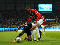 Denzel Dumfries right-back of Internazionale and Netherlands and Malick Thiaw centre-back of AC Milan and Germany compete for the ball durin...