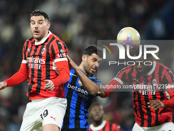 Mehdi Taremi centre-forward of Internazionale and Iran and Youssouf Fofana defensive midfield of AC Milan and France compete for the ball du...