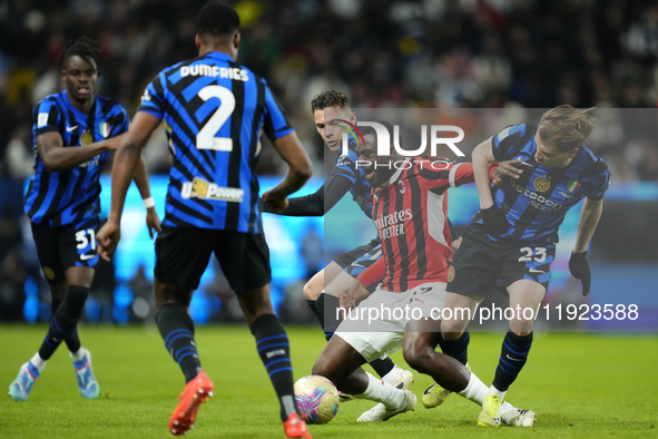 Youssouf Fofana defensive midfield of AC Milan and France surrounded by Inter players during the EA SPORTS FC SUPERCUP 24/25 final match bet...