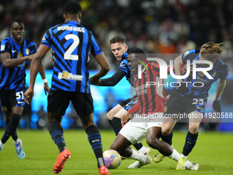 Youssouf Fofana defensive midfield of AC Milan and France surrounded by Inter players during the EA SPORTS FC SUPERCUP 24/25 final match bet...