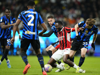 Youssouf Fofana defensive midfield of AC Milan and France surrounded by Inter players during the EA SPORTS FC SUPERCUP 24/25 final match bet...