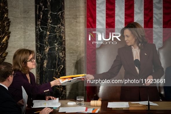 Vice President Kamala Harris receives a state's electoral certification during a joint session of the Senate and House of Representatives to...