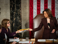 Vice President Kamala Harris receives a state's electoral certification during a joint session of the Senate and House of Representatives to...