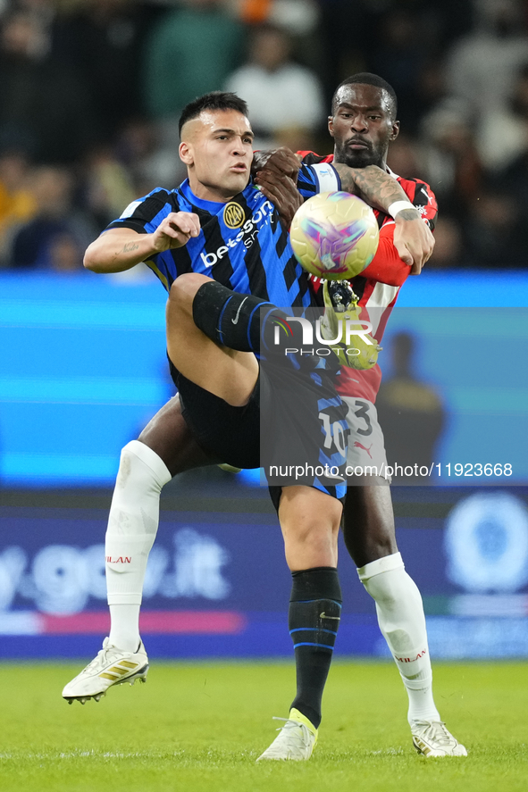 Lautaro Martinez centre-forward of Internazionale and Argentina and Fikayo Tomori centre-back of AC Milan and England compete for the ball d...