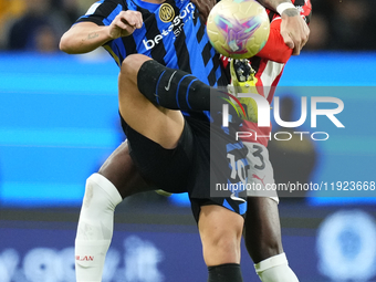 Lautaro Martinez centre-forward of Internazionale and Argentina and Fikayo Tomori centre-back of AC Milan and England compete for the ball d...