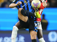 Lautaro Martinez centre-forward of Internazionale and Argentina and Fikayo Tomori centre-back of AC Milan and England compete for the ball d...