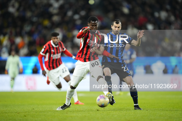 Yunus Musah central midfield of AC Milan and United States and Henrikh Mkhitaryan central midfield of Internazionale and Armenia compete for...