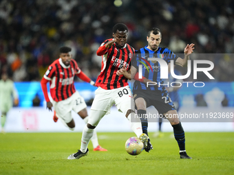 Yunus Musah central midfield of AC Milan and United States and Henrikh Mkhitaryan central midfield of Internazionale and Armenia compete for...