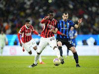 Yunus Musah central midfield of AC Milan and United States and Henrikh Mkhitaryan central midfield of Internazionale and Armenia compete for...