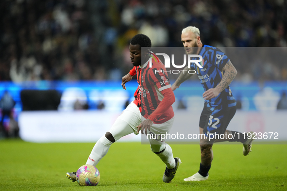 Yunus Musah central midfield of AC Milan and United States and Federico Dimarco left-back of Internazionale and Italy compete for the ball d...