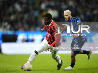 Yunus Musah central midfield of AC Milan and United States and Federico Dimarco left-back of Internazionale and Italy compete for the ball d...