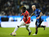 Yunus Musah central midfield of AC Milan and United States and Federico Dimarco left-back of Internazionale and Italy compete for the ball d...