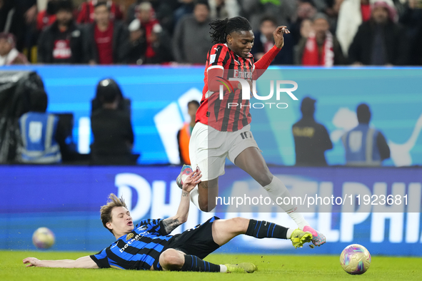 Rafael Leao left winger of AC Milan and Portugal and Nicolo Barella central midfield of Internazionale and Italy compete for the ball during...