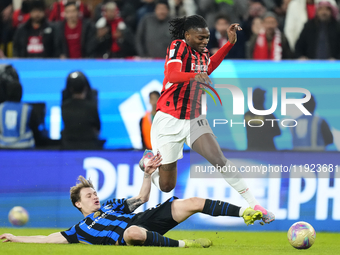 Rafael Leao left winger of AC Milan and Portugal and Nicolo Barella central midfield of Internazionale and Italy compete for the ball during...