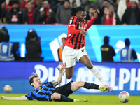 Rafael Leao left winger of AC Milan and Portugal and Nicolo Barella central midfield of Internazionale and Italy compete for the ball during...