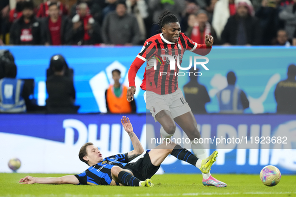 Rafael Leao left winger of AC Milan and Portugal and Nicolo Barella central midfield of Internazionale and Italy compete for the ball during...