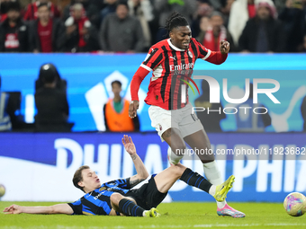 Rafael Leao left winger of AC Milan and Portugal and Nicolo Barella central midfield of Internazionale and Italy compete for the ball during...