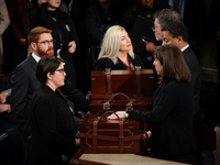 House floor staff close up the boxes containing electoral vote certificates following the conclusion of a oint session of Congress certifyin...