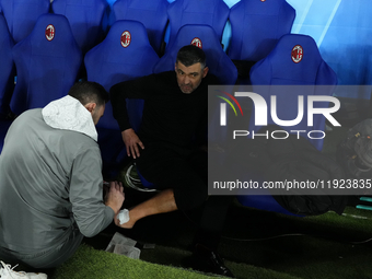 Sergio Conceiçao head coach of AC Milan heals from a celebratory injury during the EA SPORTS FC SUPERCUP 24/25 final match between FC Intern...