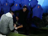 Sergio Conceiçao head coach of AC Milan heals from a celebratory injury during the EA SPORTS FC SUPERCUP 24/25 final match between FC Intern...