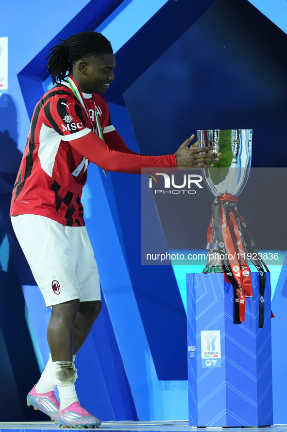 Rafael Leao left winger of AC Milan and Portugal celebrates with the trophy after winning the EA SPORTS FC SUPERCUP 24/25 final match betwee...