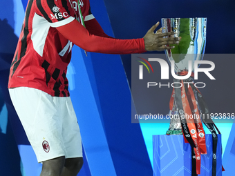 Rafael Leao left winger of AC Milan and Portugal celebrates with the trophy after winning the EA SPORTS FC SUPERCUP 24/25 final match betwee...