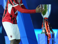 Rafael Leao left winger of AC Milan and Portugal celebrates with the trophy after winning the EA SPORTS FC SUPERCUP 24/25 final match betwee...