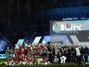 Milan team celebrates the victory after winning the EA SPORTS FC SUPERCUP 24/25 final match between FC Internazionale and AC Milan at Kingdo...