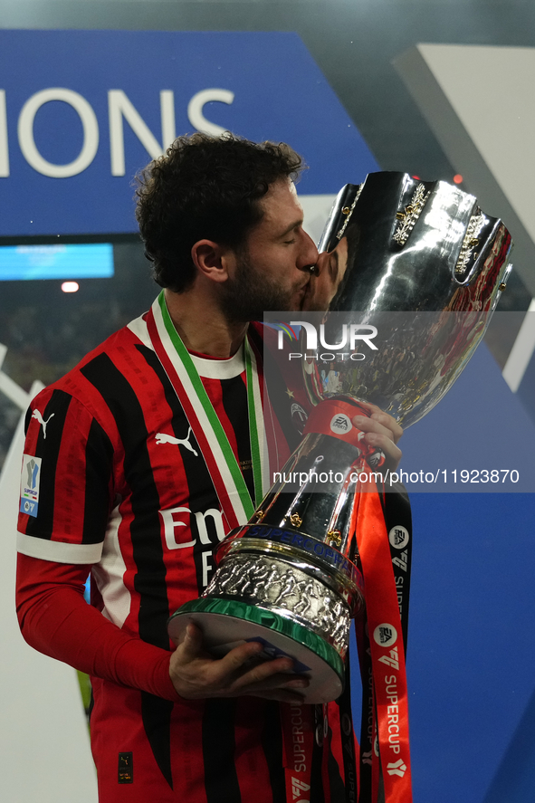 Davide Calabria right-back of AC Milan and Italy celebrates with the trophy after winning the EA SPORTS FC SUPERCUP 24/25 final match betwee...