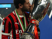 Davide Calabria right-back of AC Milan and Italy celebrates with the trophy after winning the EA SPORTS FC SUPERCUP 24/25 final match betwee...