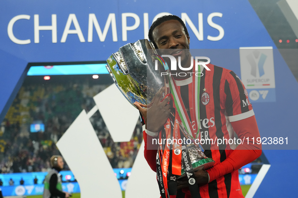 Tammy Abraham centre-forward of AC Milan and England celebrates with the trophy after winning the EA SPORTS FC SUPERCUP 24/25 final match be...