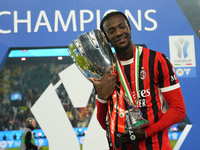 Tammy Abraham centre-forward of AC Milan and England celebrates with the trophy after winning the EA SPORTS FC SUPERCUP 24/25 final match be...