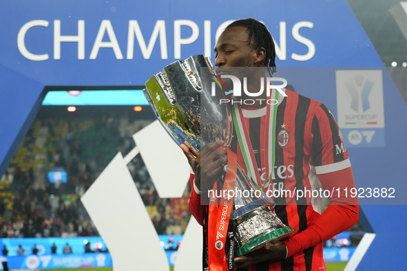 Tammy Abraham centre-forward of AC Milan and England celebrates with the trophy after winning the EA SPORTS FC SUPERCUP 24/25 final match be...