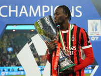 Tammy Abraham centre-forward of AC Milan and England celebrates with the trophy after winning the EA SPORTS FC SUPERCUP 24/25 final match be...