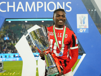 Rafael Leao left winger of AC Milan and Portugal celebrates with the trophy after winning the EA SPORTS FC SUPERCUP 24/25 final match betwee...