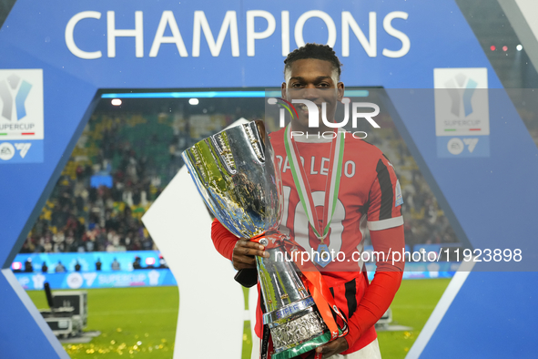 Rafael Leao left winger of AC Milan and Portugal celebrates with the trophy after winning the EA SPORTS FC SUPERCUP 24/25 final match betwee...