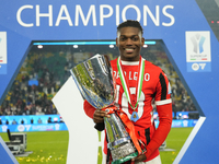 Rafael Leao left winger of AC Milan and Portugal celebrates with the trophy after winning the EA SPORTS FC SUPERCUP 24/25 final match betwee...