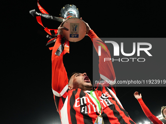 Theo Hernandez left-back of AC Milan and France lifts the trophy after winning with his team the EA SPORTS FC SUPERCUP 24/25 final match bet...