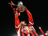 Theo Hernandez left-back of AC Milan and France lifts the trophy after winning with his team the EA SPORTS FC SUPERCUP 24/25 final match bet...