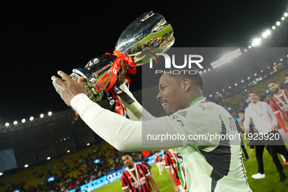 Mike Maignan goalkeeper of AC Milan and France celebrates with the trophy after winning the EA SPORTS FC SUPERCUP 24/25 final match between...