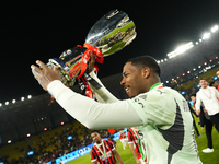 Mike Maignan goalkeeper of AC Milan and France celebrates with the trophy after winning the EA SPORTS FC SUPERCUP 24/25 final match between...