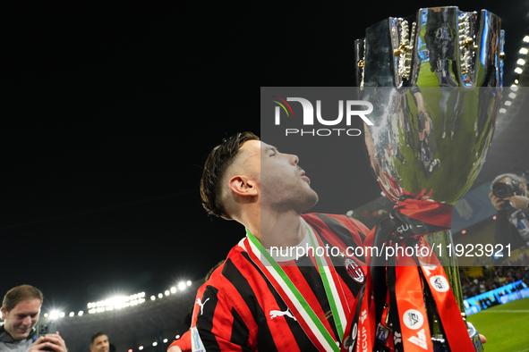 Theo Hernandez left-back of AC Milan and France lifts the trophy after winning with his team the EA SPORTS FC SUPERCUP 24/25 final match bet...