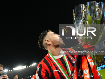 Theo Hernandez left-back of AC Milan and France lifts the trophy after winning with his team the EA SPORTS FC SUPERCUP 24/25 final match bet...