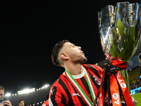 Theo Hernandez left-back of AC Milan and France lifts the trophy after winning with his team the EA SPORTS FC SUPERCUP 24/25 final match bet...