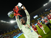 Mike Maignan goalkeeper of AC Milan and France celebrates with the trophy after winning the EA SPORTS FC SUPERCUP 24/25 final match between...