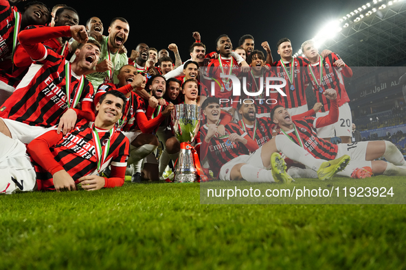 Milan players celebrate with the trophy after winning the EA SPORTS FC SUPERCUP 24/25 final match between FC Internazionale and AC Milan at...