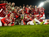 Milan players celebrate with the trophy after winning the EA SPORTS FC SUPERCUP 24/25 final match between FC Internazionale and AC Milan at...