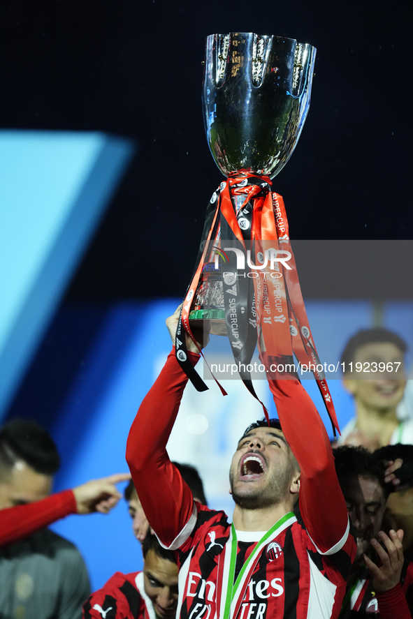 Theo Hernandez left-back of AC Milan and France lifts the trophy after winning with his team the EA SPORTS FC SUPERCUP 24/25 final match bet...