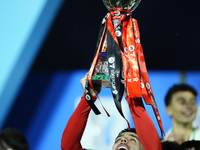 Theo Hernandez left-back of AC Milan and France lifts the trophy after winning with his team the EA SPORTS FC SUPERCUP 24/25 final match bet...