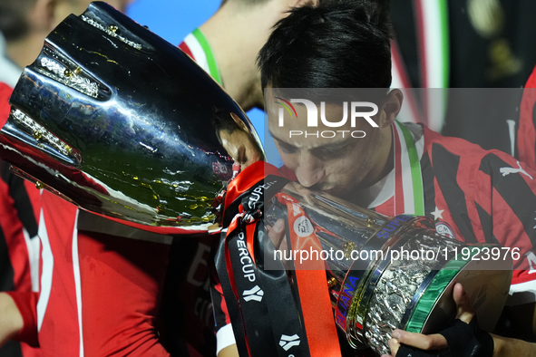 Ismael Bennacer defensive midfield of AC Milan and Algeria  celebrates with the trophy after winning the EA SPORTS FC SUPERCUP 24/25 final m...